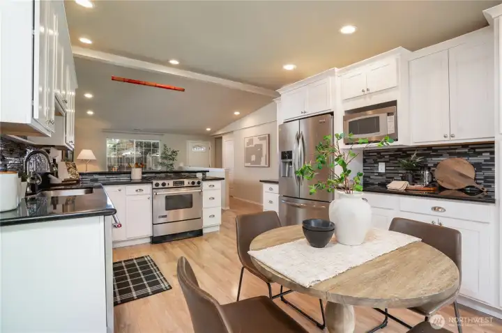 There is a coat closet next to the front door. Turn left before the kitchen to find 4 rooms.