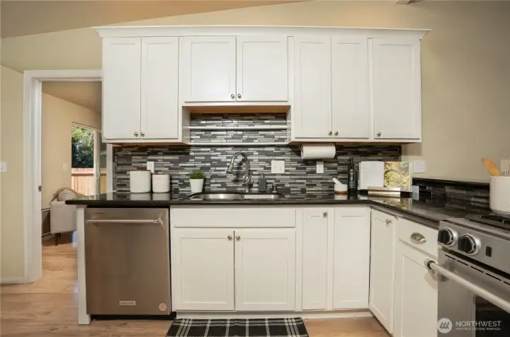 Through the kitchen, you have an office/room with a bathroom.