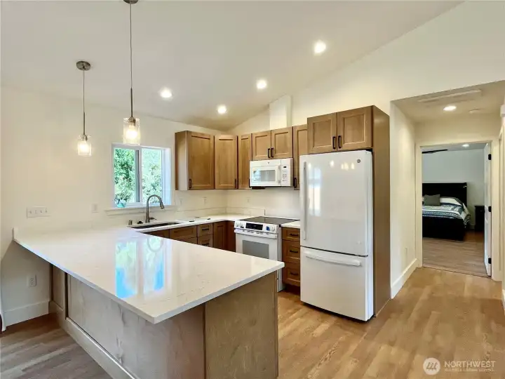 Just steps away from the kitchen is access to the Primary Bedroom, Laundry and Garage
