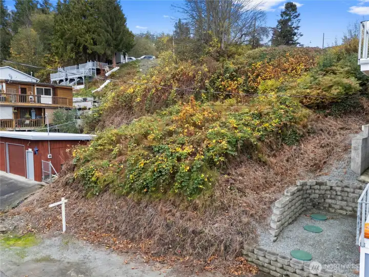 Premium Camano Island sloped lot ideal for capturing panoramic sunrise and sunset vistas.