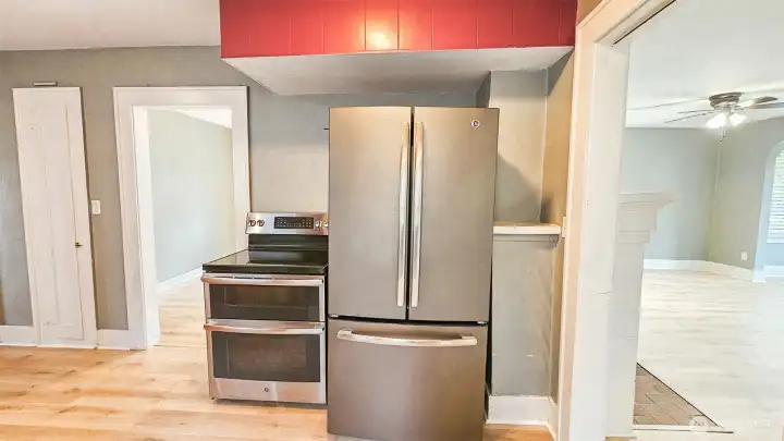 Other view of kitchen.  Appliances included!  A peek-a-boo view of the LR to the right, and the doorway into the Dining Rm to left of stove