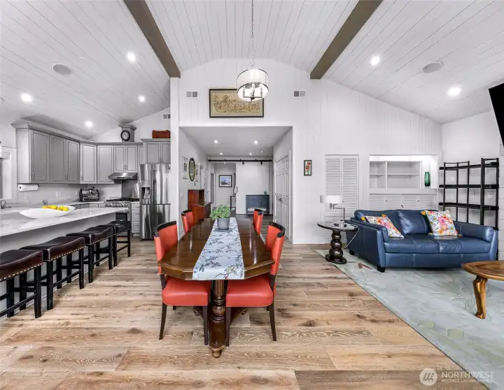 As you enter into the main living space, you'll immediately notice the attention to detail of this remodel - vaulted ceilings with exposed beams and a light bright and airy feeling just filled with natural light.