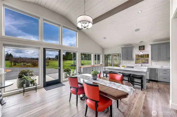 The main living is encompassed with large windows, overlooking the property and on a clear day Mt Baker.