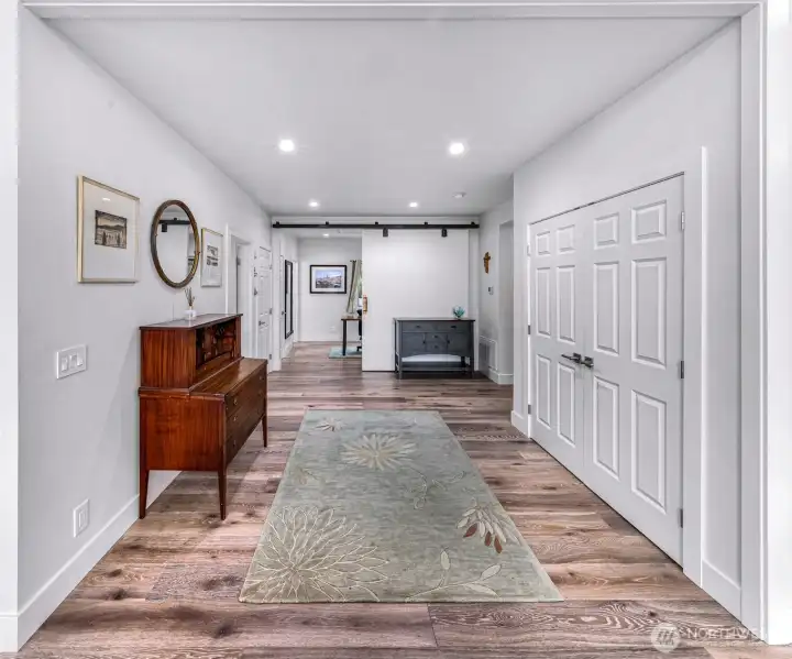 Foyer to utility, office bathrooms and storage