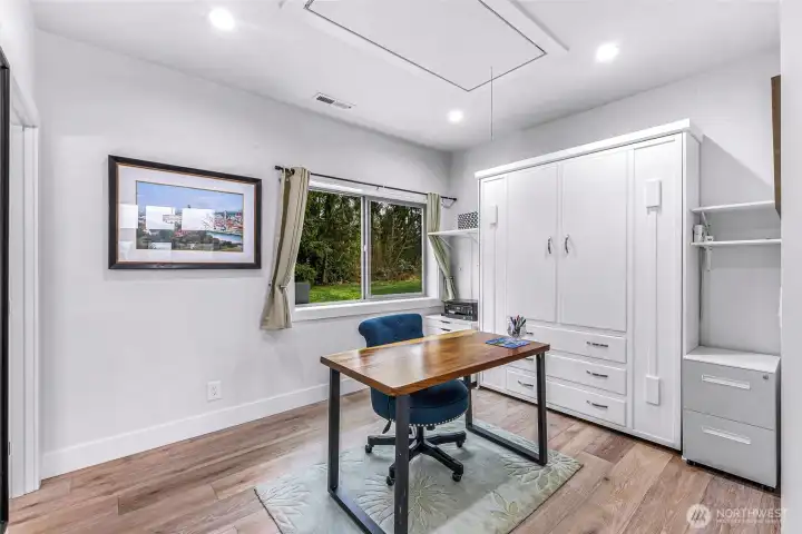Office located on the main floor with built in murphy bed and access to attic
