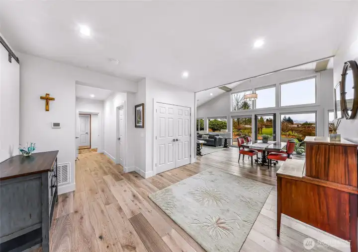 Hallway leads to bedroom, large walk in pantry and storage room, 3/4 bath, additional bedroom and flex space.