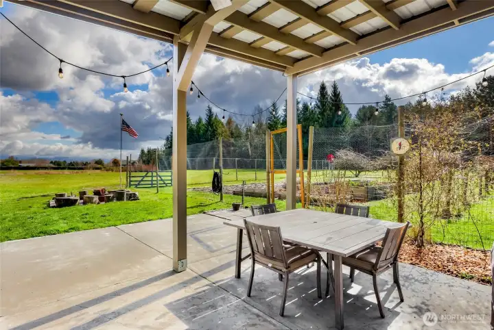 Experience all PNW seasons on this covered patio, over looking all the incredible gardens and beautiful views