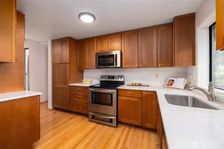 Kitchen with 2007 installed cabinets and solid surface countertops.