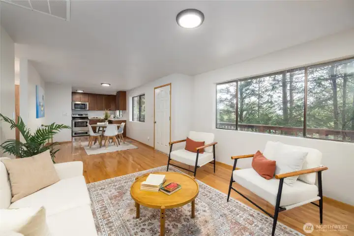 Living room with large windows, east facing.
