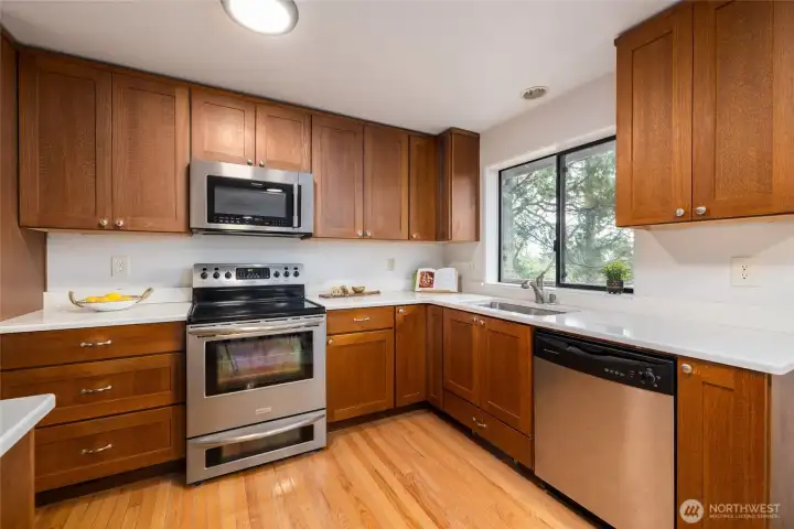 Kitchen with 2007 installed cabinets and solid surface countertops.