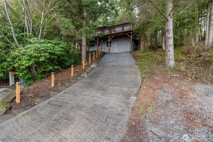 Steep driveway - can park next to driveway and use steps.