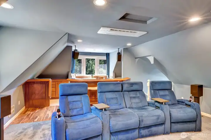 This great theatre room features wet bar &  roomy wet bar and has a mini-split climate control.