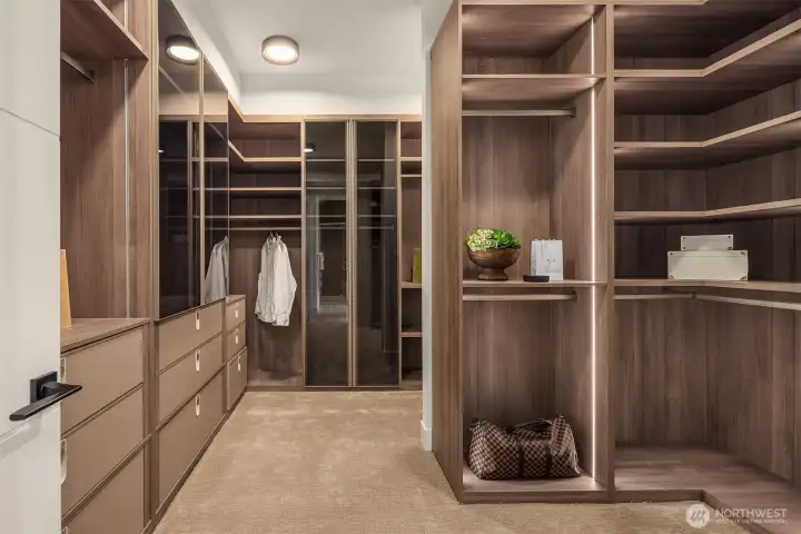 This oversized closet is beautifully finished with high-end custom caibnetry.