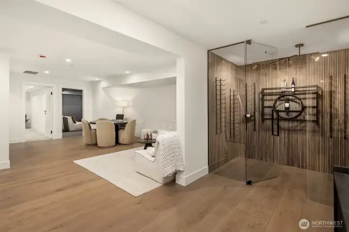 The lower entertainment level, complete with a wine cellar when you first walk down! This space also features a wet bar with a fridge and microwave.