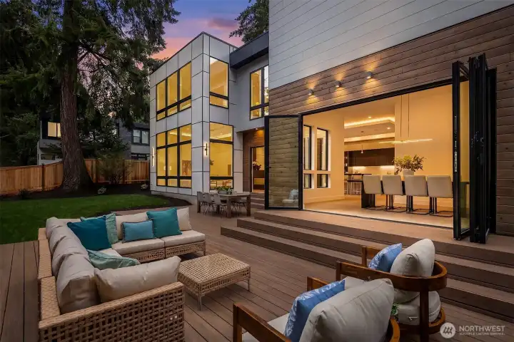 Outside, a massive deck overlooks a tranquil water feature.