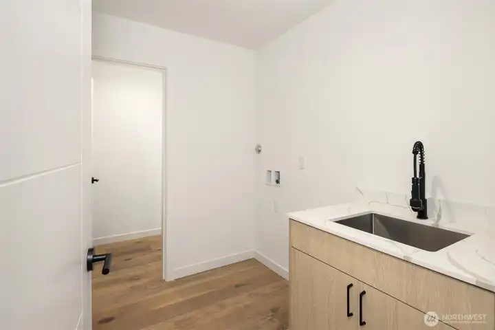 Great laundry room with sink on second floor
