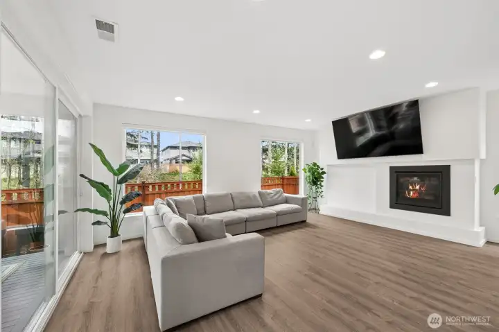 Great room with gas fireplace and double slider out to outdoor room