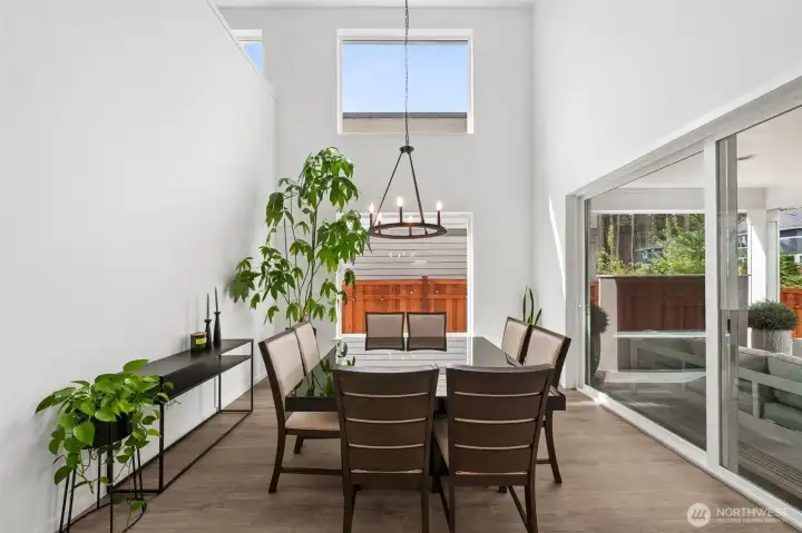 Two story dining room with tons of natural light