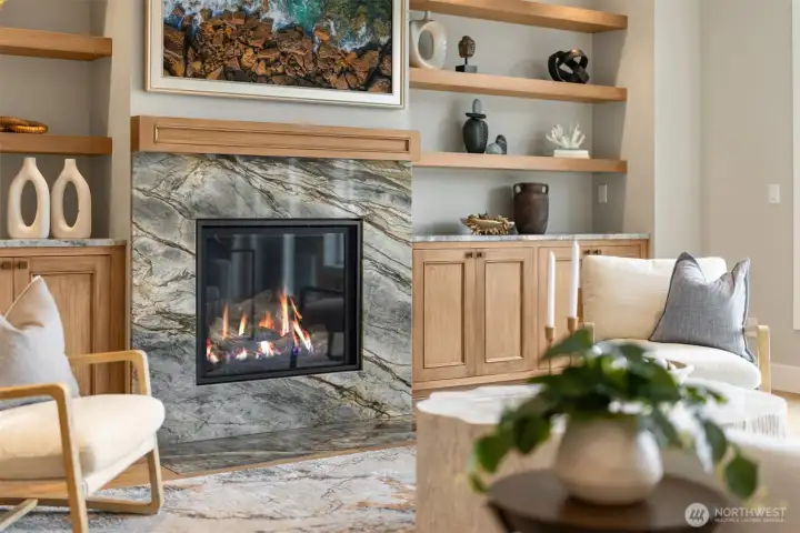 Spacious living area with floating selves and stone surround fireplace, with propane.