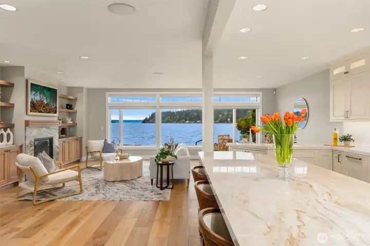 Granite slab island counter top by Grandy Tile and Marble..So fun to have seating at the island for keeping the chef company!!