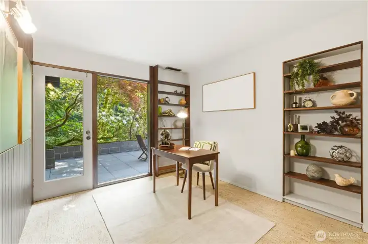 The lower-level flex space works beautifully as a den or home office, with a door opening directly to the patio.