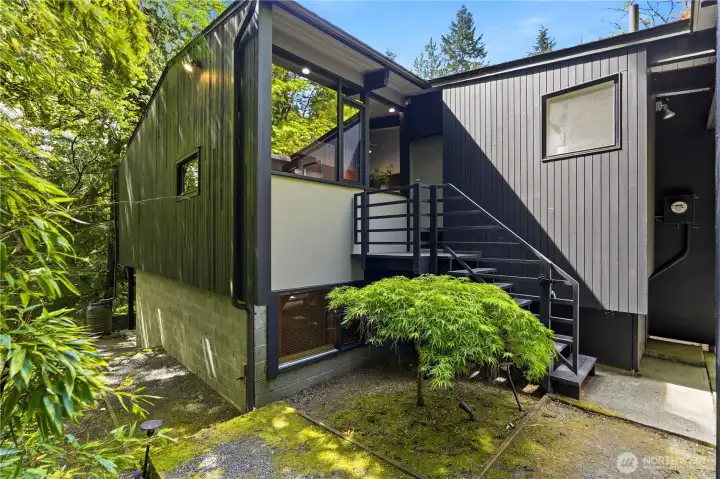 Side stairs connect the carport directly to the kitchen for easy everyday access.