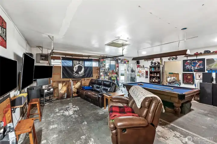 Detached 1,242 square foot shop with electricity, heating, and ventilation on it's own electrical panel.