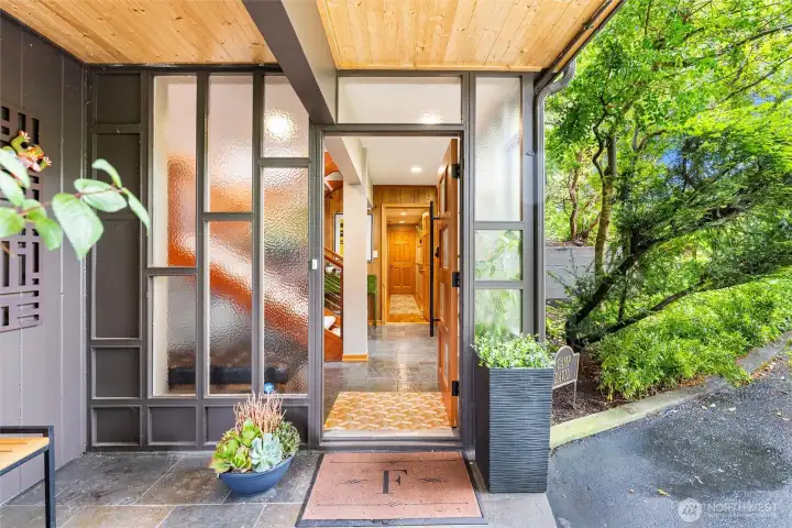 A striking front entry sets the tone for the home’s distinctive architectural style, blending natural materials, clean lines, and timeless design character. A striking front entry sets the tone for the home’s distinctive architectural style, blending natural materials, clean lines, and timeless design character.
