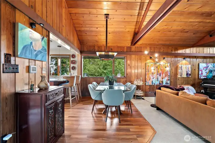 Warm and inviting dining area with wood-clad ceilings and seamless connection to the living spaces. Warm and inviting dining area with wood-clad ceilings and seamless connection to the living spaces.