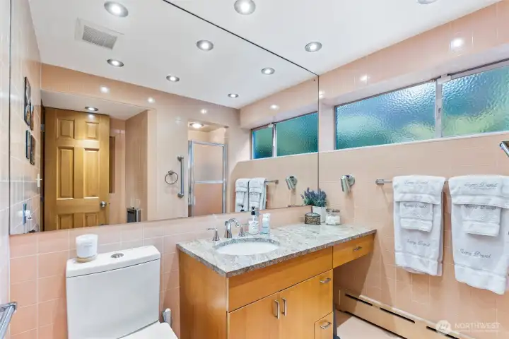Vintage-inspired bath with preserved character, generous counter space, and abundant natural light. Vintage-inspired bath with preserved character, generous counter space, and abundant natural light.