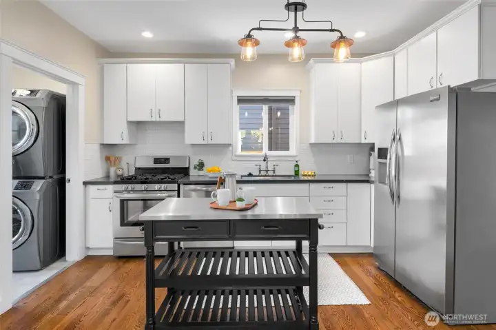 Remodeled kitchen with quartz counters, updated cabinets and stainless appliances.