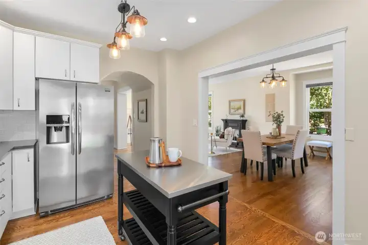 Remodeled kitchen with quartz counters, updated cabinets and stainless appliances.