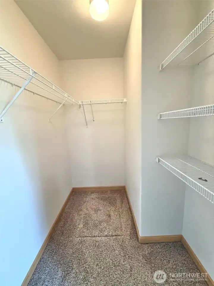 Primary walk-in closet.