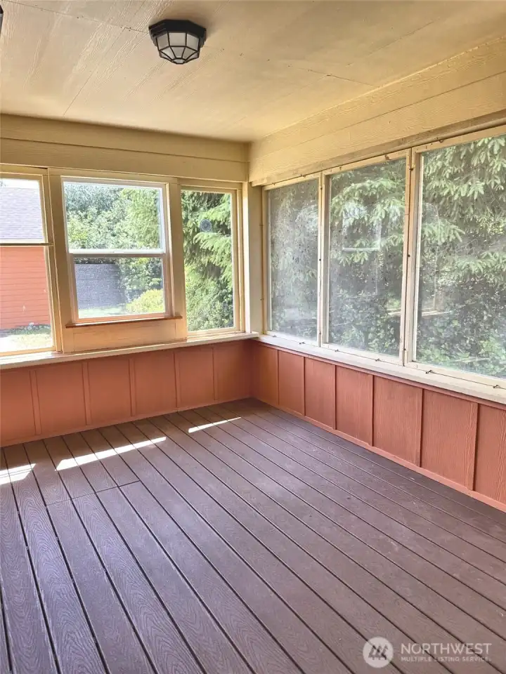 The enclosed back porch with a heater for the cooler evenings!