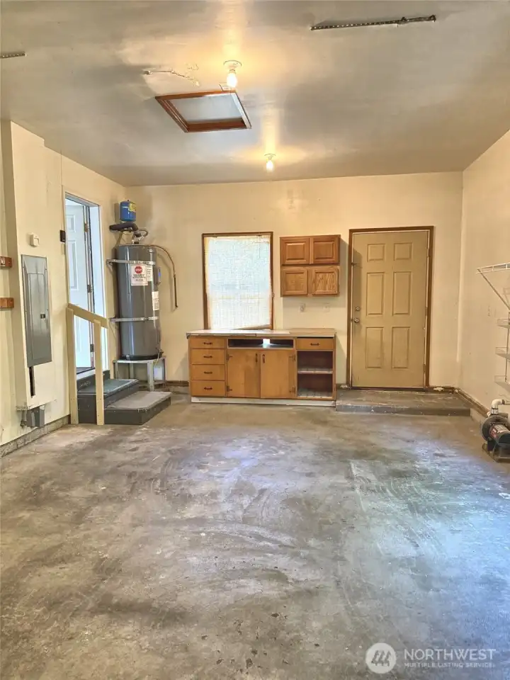 More shelving & the hot water tank, entry to living area.