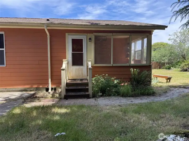 Back entry from the sunroom to yard.