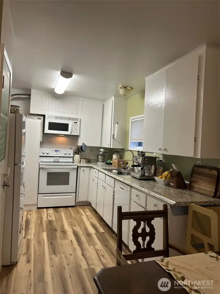 Kitchen area has been updated with new flooring.