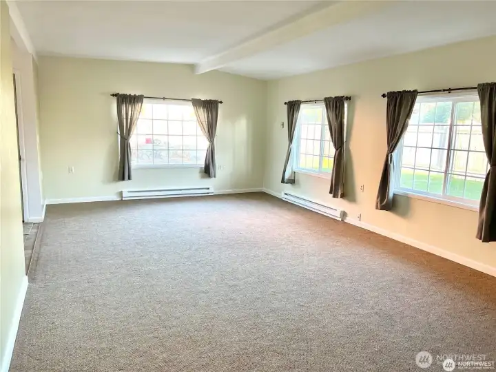 Large living room area in detached house.