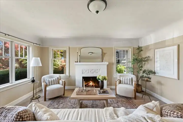 Period details include original brick fireplace, plaster walls, coved ceilings, & picture rail trim. Period details include original brick fireplace, plaster walls, coved ceilings, & picture rail trim.