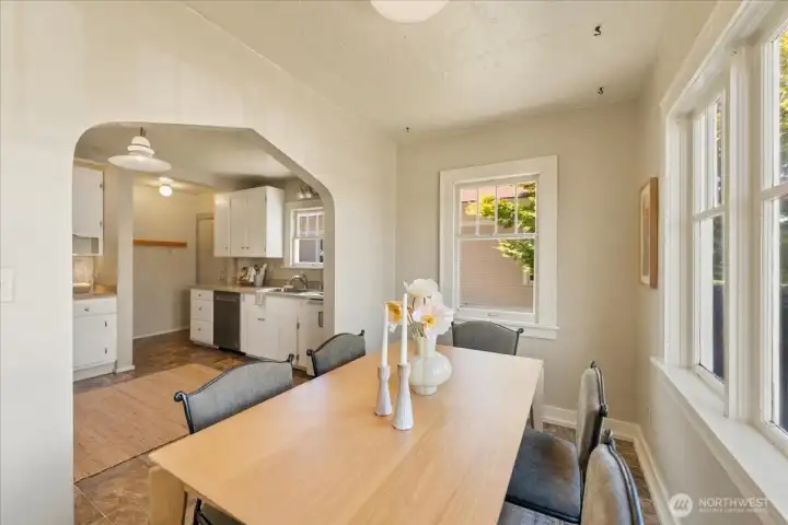 Dining area off the kitchen features classic arched entryway. Dining area off the kitchen features classic arched entryway.