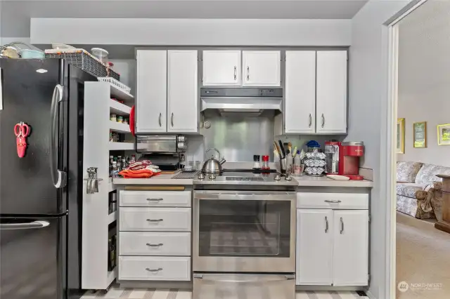 Main kitchen area includes newer stainless steel appliances