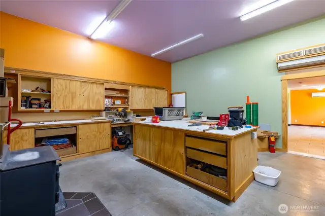 Shop space has wood heat and is connected to the living room.