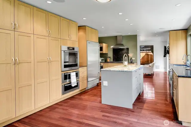 Extensive storage is found in the kitchen, along with upscale Miele, Wolf, and Sub-Zero appliances.