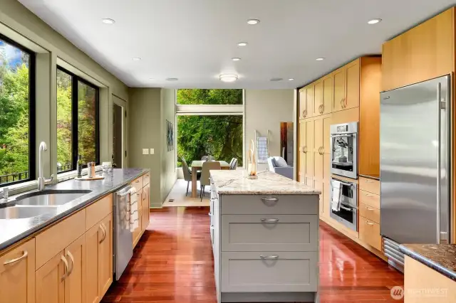 Large windows bring in natural light and provide a view of Allen Creek from the kitchen.