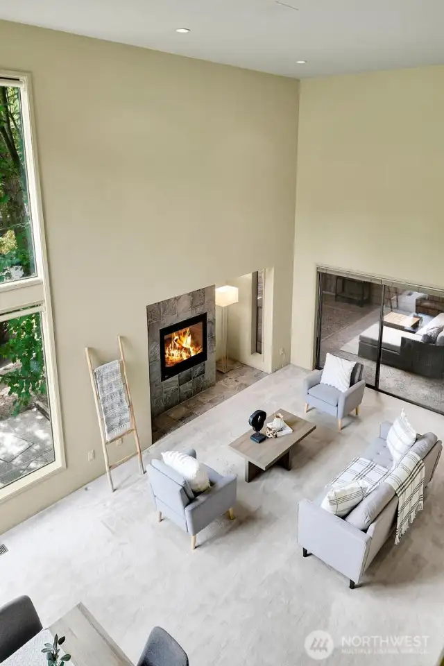 A look down at the living room from the lofted upper level bedroom.