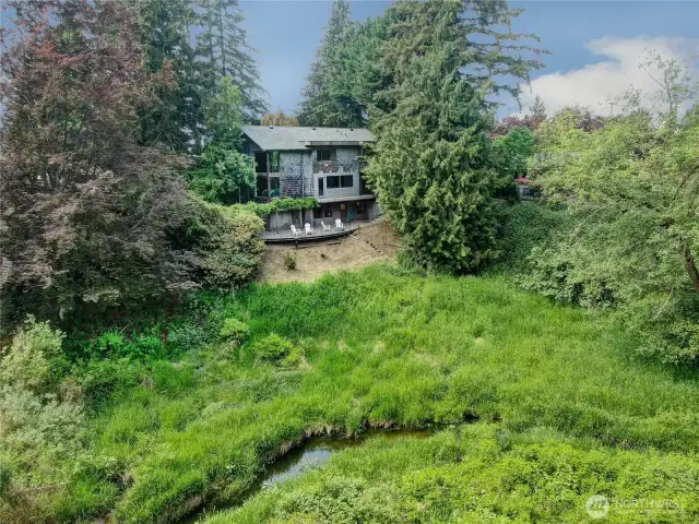 Drone photo back towards the home taken above the east side of Allen Creek.