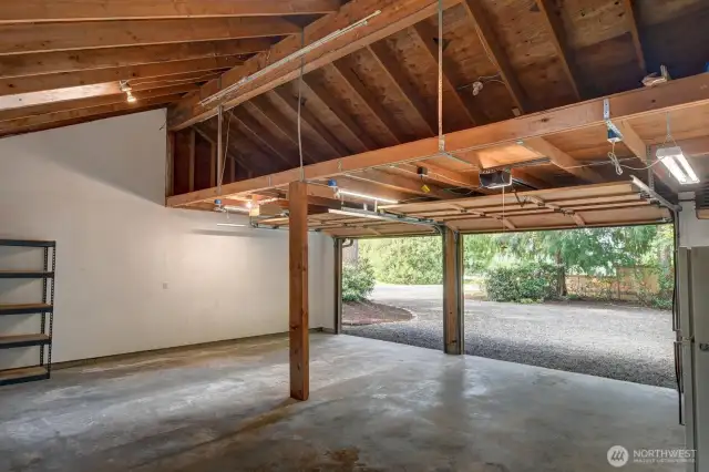 The 2-car garage has plenty of lofted storage and room for a workbench and extra storage racks.