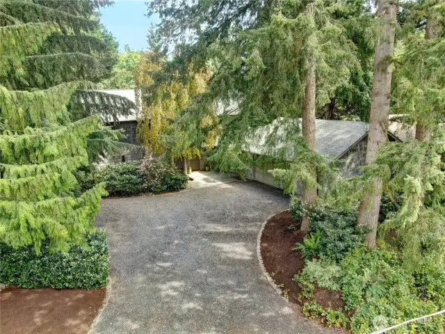 Elevated photo from the street of the natural approach to this wonderful residence.