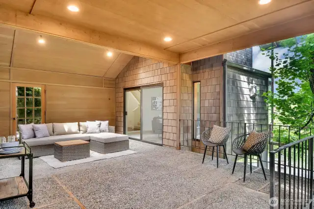 The loggia is a covered outdoor living space between the house and the garage.