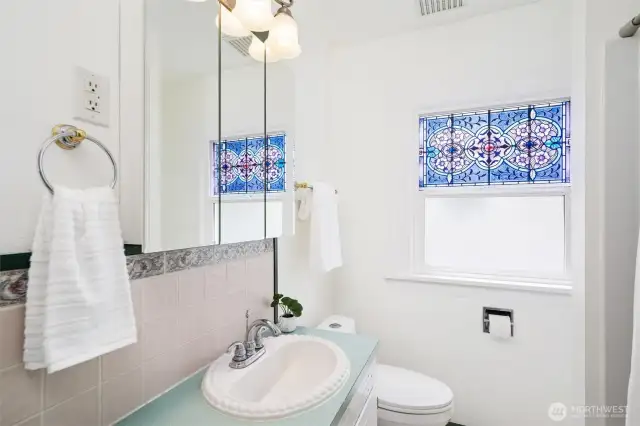 A recenlty updated bathroom with a new tub shower surround.
